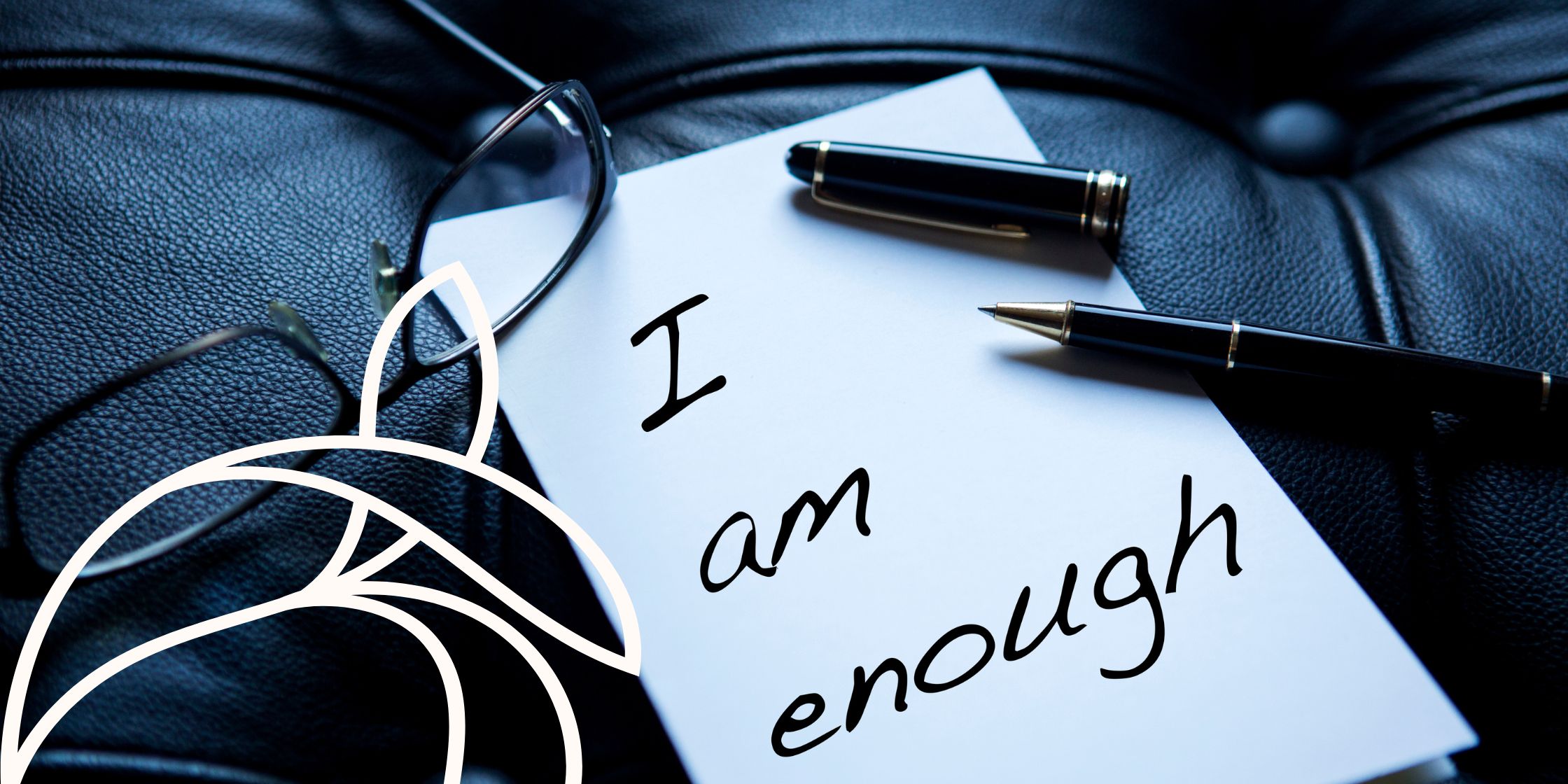 A slip of paper reads, "I am enough". An effective reminder of the power our words have on us.