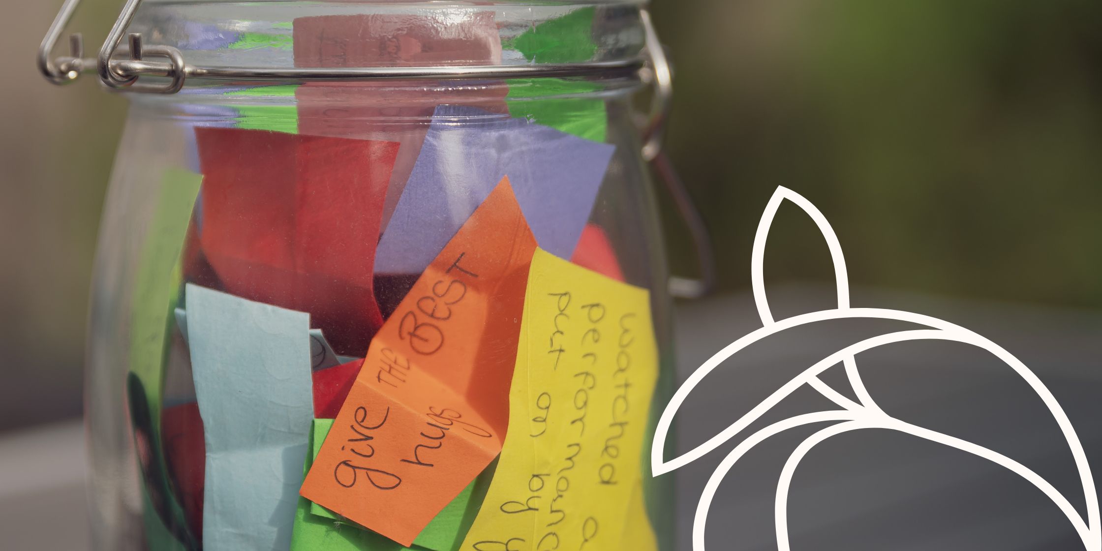 A simple jar filled with scraps of paper, each containing a positive affirmation.